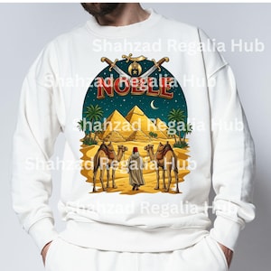 May include: A white crewneck sweatshirt featuring a graphic print of two camels, a person in traditional attire, and pyramids under a night sky. The text NOBLE is printed in red above the pyramids, with two crossed swords and a crescent moon emblem.