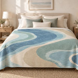 May include: A bedspread featuring a wavy, abstract pattern in shades of blue, teal, and beige. The design consists of flowing, curved bands of color that span the width of the fabric, creating a layered, organic look across the entire surface.