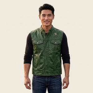 May include: A dark green leather waistcoat featuring a stand-up collar, two chest pockets with button closures, and two side pockets. An eagle emblem is embroidered on the upper left chest above the text Biketoberfest 2023 in black lettering.