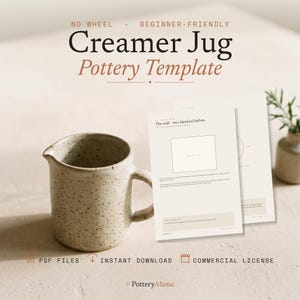 May include: A speckled beige ceramic creamer jug sits next to printed pottery template pages. The text reads: NO WHEEL - BEGINNER-FRIENDLY Creamer Jug Pottery Template. The pages include instructions titled The wall - two identical halves.