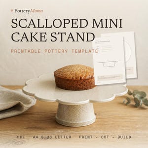 May include: A beige speckled ceramic cake stand with a scalloped edge holding a small round cake. The image includes text reading PotteryMama SCALLOPED MINI CAKE STAND PRINTABLE POTTERY TEMPLATE, along with PDF A4 & US LETTER PRINT - CUT - BUILD.