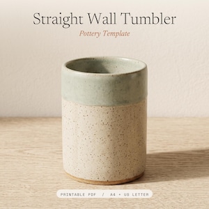 May include: A cylindrical ceramic tumbler with a straight wall design. The upper portion is a smooth sage green, while the lower portion is a speckled cream color. Text above reads Straight Wall Tumbler Pottery Template and below reads PRINTABLE PDF / A4 + US LETTER.