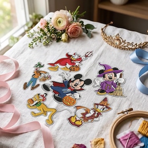 May include: A collection of six embroidered patches featuring Disney characters in Halloween costumes, including Mickey Mouse as a vampire, Minnie Mouse as a witch, Donald Duck as a devil, Daisy Duck as a wizard, Goofy as a scarecrow, and Pluto.