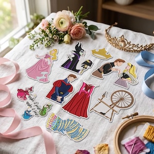 May include: A collection of embroidered patches featuring characters and items from a fairy tale, including a princess in a pink dress, a villain, a prince, a spinning wheel, a birthday cake, and text that reads make it pink make it blue.
