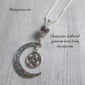 The Moon Goddess Necklace features a silve-coloured filigree Crescent Moon with a pentacle hanging within. Above the moon is a gemstone bead (Purple agate is featured) but when ordering you can choose from a selection.