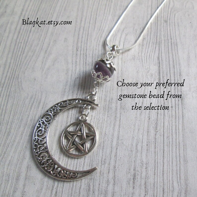 The Moon Goddess Necklace features a silve-coloured filigree Crescent Moon with a pentacle hanging within. Above the moon is a gemstone bead (Purple agate is featured) but when ordering you can choose from a selection.