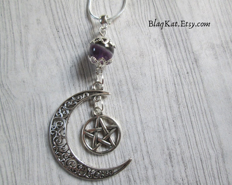 Close up of the pentacle and crescent moon charms