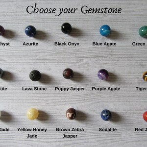 Choose your gemstone. 
A selection is offered including Amethyst, Azurite, Black Onyx, Blue Agate, Green Agate, Hematite, Lava Stone, Poppy Jasper, Purple Agate, Tigers Eye, White Jade, Yellow Honey Jade, Brown Zebra Jasper, Sodalite and Red Jasper