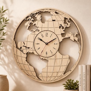 May include: A circular wall clock featuring a light-colored wood frame shaped like a world map with etched longitudinal and latitudinal lines. The center dial is a round wooden face with black Arabic numerals, black hour and minute hands, and a red second hand.