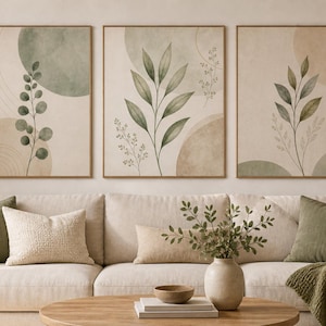 May include: A set of three rectangular wall art prints featuring botanical illustrations of green leaves and abstract circles in muted earth tones. Each print is framed in a thin wood border, displaying a cohesive design of foliage and geometric shapes.