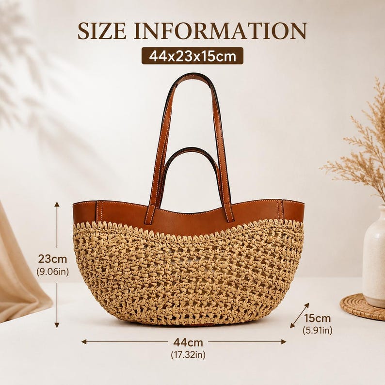 May include: A tan woven straw tote bag with brown leather trim and two handles. The bag features a curved top design and measures 44cm wide, 23cm high, and 15cm deep, as indicated by the text SIZE INFORMATION 44x23x15cm on the image.