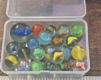 Vintage and vintage-style, likely mid-century to late 20th century, with cat’s-eye, swirl, and colorful shooter marbles.