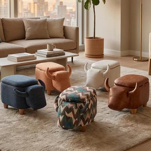 May include: Five animal-shaped storage ottomans with four short wooden legs and curved horns. The ottomans feature various textures and colors, including blue fabric, orange fabric, a white smooth finish, brown faux leather, and a multi-colored chevron pattern.