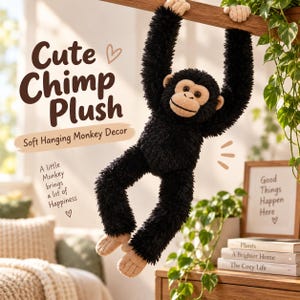 May include: A black plush chimpanzee toy with a tan face, hands, and feet, hanging from a wooden bar. The image includes text: Cute Chimp Plush, Soft Hanging Monkey Decor, A little Monkey brings a lot of Happiness, and Good Things Happen Here.