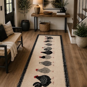 May include: A rectangular runner rug with a beige background and a black border. The rug features a central vertical row of nine stylized chickens in various patterns, including black, gray, and black-and-white gingham, all with red combs.