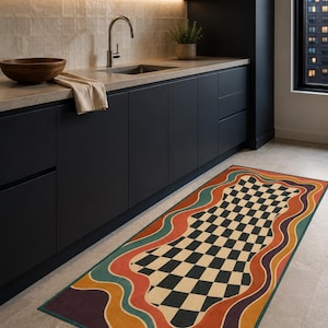 May include: A rectangular runner rug featuring a central black and cream checkered pattern surrounded by wavy, concentric borders in shades of orange, teal, and deep purple. The rug has a finished edge and lies flat on a light-colored floor.