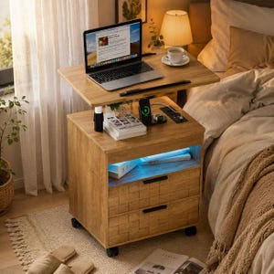May include: A light brown wooden bedside table with a height-adjustable top surface, two drawers with black handles, a built-in wireless charging pad, a power strip, and an open shelf with blue LED lighting, all mounted on four black caster wheels.