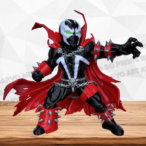 Peut inclure: Une figurine articulée stylisée de Spawn avec un costume noir aux marquages blancs sur la poitrine, une cape rouge flottante, ainsi que des gantelets et des bottes rouges à pointes argentées. Le personnage porte une chaîne argentée à tête de mort.