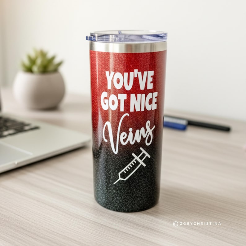 May include: A stainless steel tumbler with a red and black glitter gradient. The white text reads "YOU'VE GOT NICE Veins" with a syringe graphic. The tumbler has a clear lid and is designed for cold beverages.