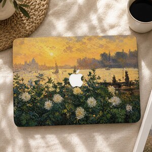 May include: A rectangular laptop skin featuring an impressionist painting of a sunset over a body of water with a sailboat, dark green foliage, and white flowers in the foreground. The design includes a central cutout for the white Apple logo.