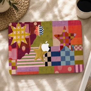 May include: A laptop skin featuring a vibrant patchwork design with various geometric patterns, including stripes, checkers, and polka dots in shades of yellow, red, blue, green, and purple, with a cutout for the Apple logo and a gold star.