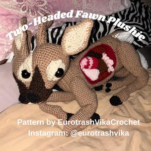May include: A two-headed fawn plushie with tan yarn, dark brown muzzles, and black eyes. The side features an open red cavity revealing pink and brown internal organs. Text reads: Two-Headed Fawn Plushie, Pattern by EurotrashVikaCrochet, Instagram: @eurotrashvika.