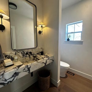 Calacatta Viola Marble Sink with Bold Natural Veining and Backsplash