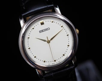 US Duty Paid Vintage 1989 Seiko V701-1T30 Silver Round Quartz 32mm Mens Watch JAPAN