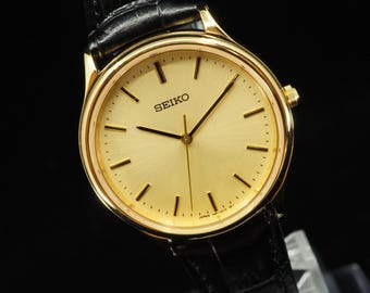 US Duty Paid Vintage 1994 N MINT Seiko 7N01-0BD0 Gold Quartz 32mm Mens Watch JAPAN New Batt
