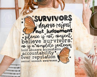 May include: A beige tie-dye t-shirt featuring black text that reads: SURVIVORS deserve respect not judgement silence is not consent believe survivors. no is a complete sentence hold abusers accountable accountability over reputation sexual assault awareness. Two orange monarch butterflies and small black stars are printed on the back.