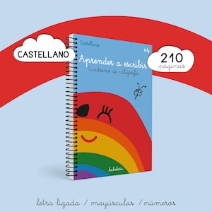 Op de afbeelding: Een spiraalgebonden kalligrafiewerkboek met een lichtblauwe kaft en een lachende regenboogafbeelding. De tekst luidt "Castellano", "Aprender a escribir", "Cuaderno de caligrafia", "+4", "210 paginas", "letra ligada", "mayusculas" en "numeros".