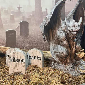 May include: A grey stone-colored gargoyle statue with large wings crouched next to three small, light-colored tombstone-shaped markers. The markers feature wood grain textures and the black printed text labels Gibson and Ibanez.