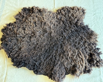 Handmade vegetarian felted brown wool rug