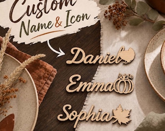 May include: Three laser-cut wooden name tags in a cursive script font. The first tag reads Daniel with a turkey icon, the second reads Emma with a pumpkin icon, and the third reads Sophia with a maple leaf icon. Text reads Custom Name & Icon.