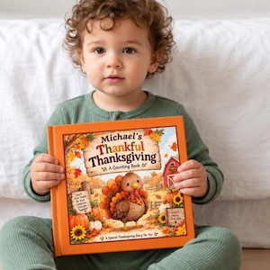 May include: A hardcover children's book titled Michael's Thankful Thanksgiving: A Counting Book. The orange cover features a cartoon turkey, pumpkins, sunflowers, and a red barn. The text reads Count Give Thanks Be Kind Celebrate Cherish Together.