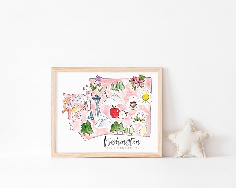 K&ouml;nnte beinhalten: Eine gerahmte Aquarellillustration des Bundesstaates Washington mit ikonischen Sehensw&uuml;rdigkeiten und Symbolen wie dem Space Needle, Bergen, einer Kaffeetasse, einem Apfel und einer Birne. Der Text "Washington, The Evergreen State" befindet sich am unteren Rand der Illustration.