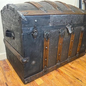 Victorian humpback treasure chest professionally refinished by Angelina Nikon.