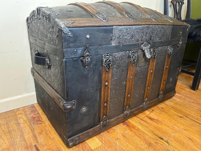 Victorian humpback treasure chest professionally refinished by Angelina Nikon.