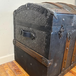Side profile highlighting the high arched dome lid of a 34 inch travel trunk.