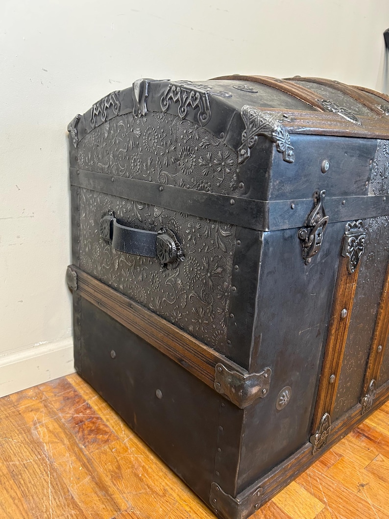 Side profile highlighting the high arched dome lid of a 34 inch travel trunk.