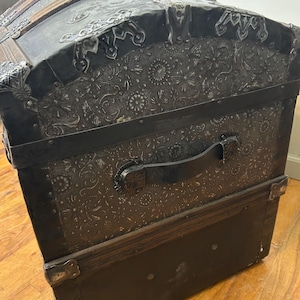 Detailed close-up of the rare architectural relief pattern on 1800s embossed tin.
