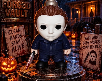 May include: A soap dispenser shaped like a character with a white mask, brown hair, and a dark blue jumpsuit, holding a small knife. The base is circular and metallic with the text FORG3D VAULT. Nearby signs read CLEAN HANDS STAY ALIVE and BATH AND BODY WORKS SOAP HOLDER.