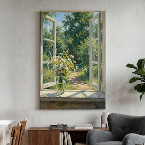 May include: A rectangular wall art print depicting an open window looking out onto a lush green garden path. A clear glass vase filled with white and yellow wildflowers sits on the wooden windowsill, illuminated by bright natural daylight.
