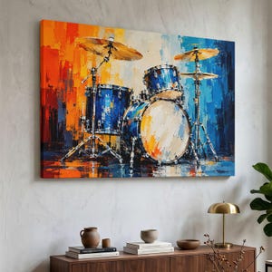May include: A rectangular wall art print featuring an abstract oil painting of a drum set. The composition displays a blue drum kit with metallic cymbals set against a vibrant background of vertical brushstrokes in shades of orange, yellow, and blue.
