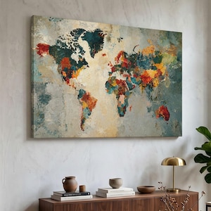 May include: A rectangular wall art canvas featuring a world map depicted in an abstract style. The continents are rendered with textured, layered brushstrokes in vibrant shades of red, orange, yellow, teal, and deep blue against a neutral background.
