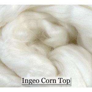 May include: Close-up of a white, fluffy, natural fiber called Ingeo Corn Top. The fiber is made from corn and is a sustainable alternative to traditional fibers.