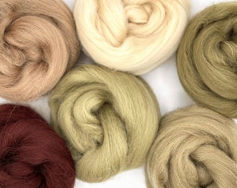 May include: Six balls of wool yarn in various shades of brown, green, and red. The yarn is soft and fluffy, perfect for knitting or crocheting.