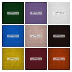 May include: Nine squares of Merino Prefelt fabric in various colors, including green, purple, white, blue, tan, brown, yellow, red, and orange. Each square has a label with the color name and "Merino Prefelt".