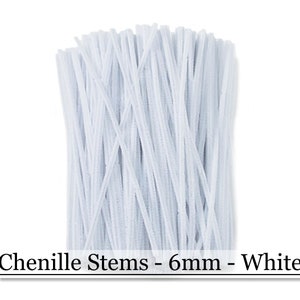 May include: A bundle of white chenille stems, 6mm thick, ideal for crafting. The stems are tightly packed together, creating a fluffy, textured appearance. The image includes the text "Chenille Stems - 6mm - White".