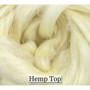 May include: Close-up of a pile of natural-colored hemp fiber. The fibers are soft and flowing, with a creamy, off-white hue. The text "Hemp Top" is displayed in a simple font at the bottom of the image.